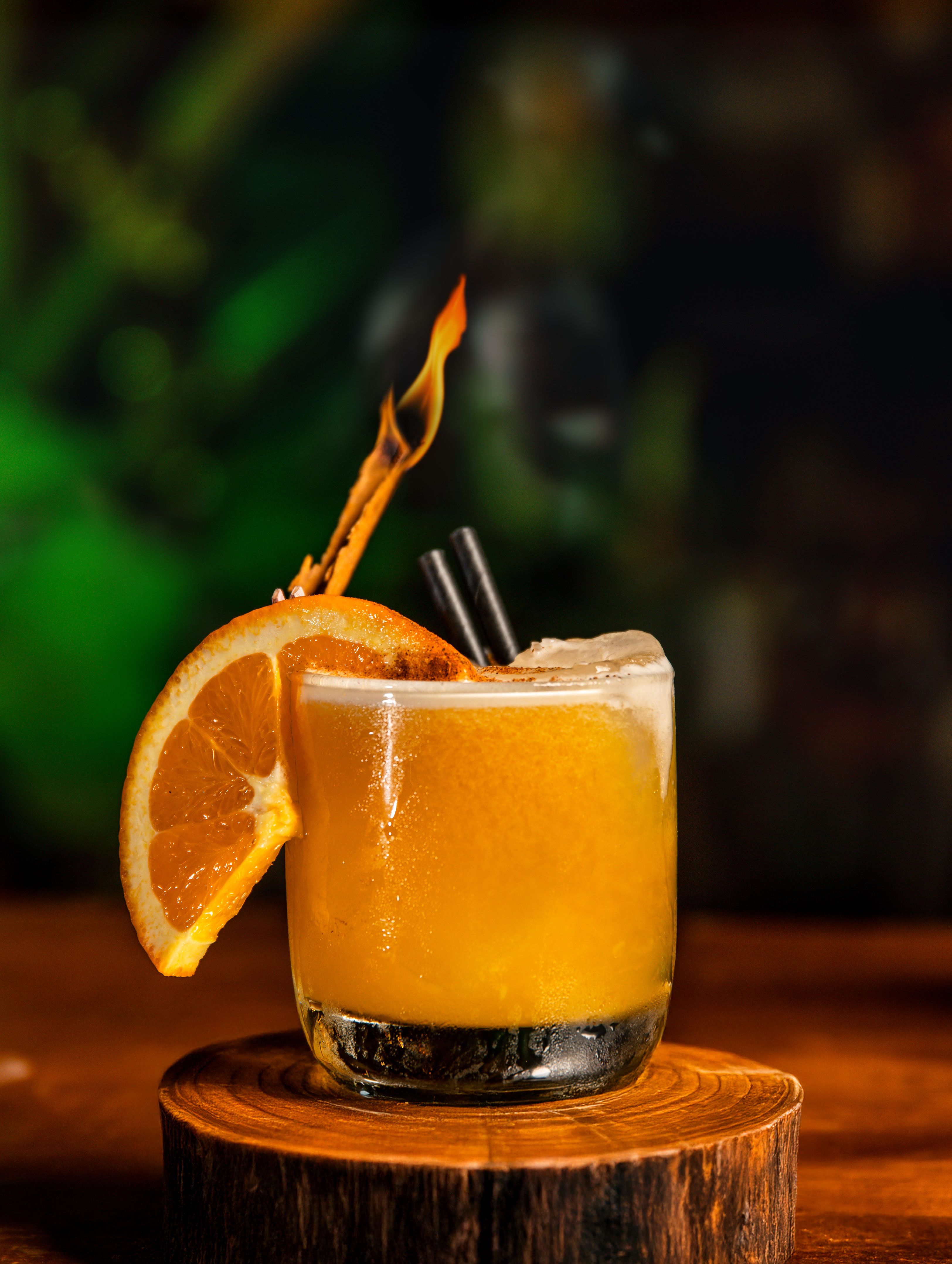 Vibrant Orange Cocktail with Flaming Garnish · Free Stock Photo