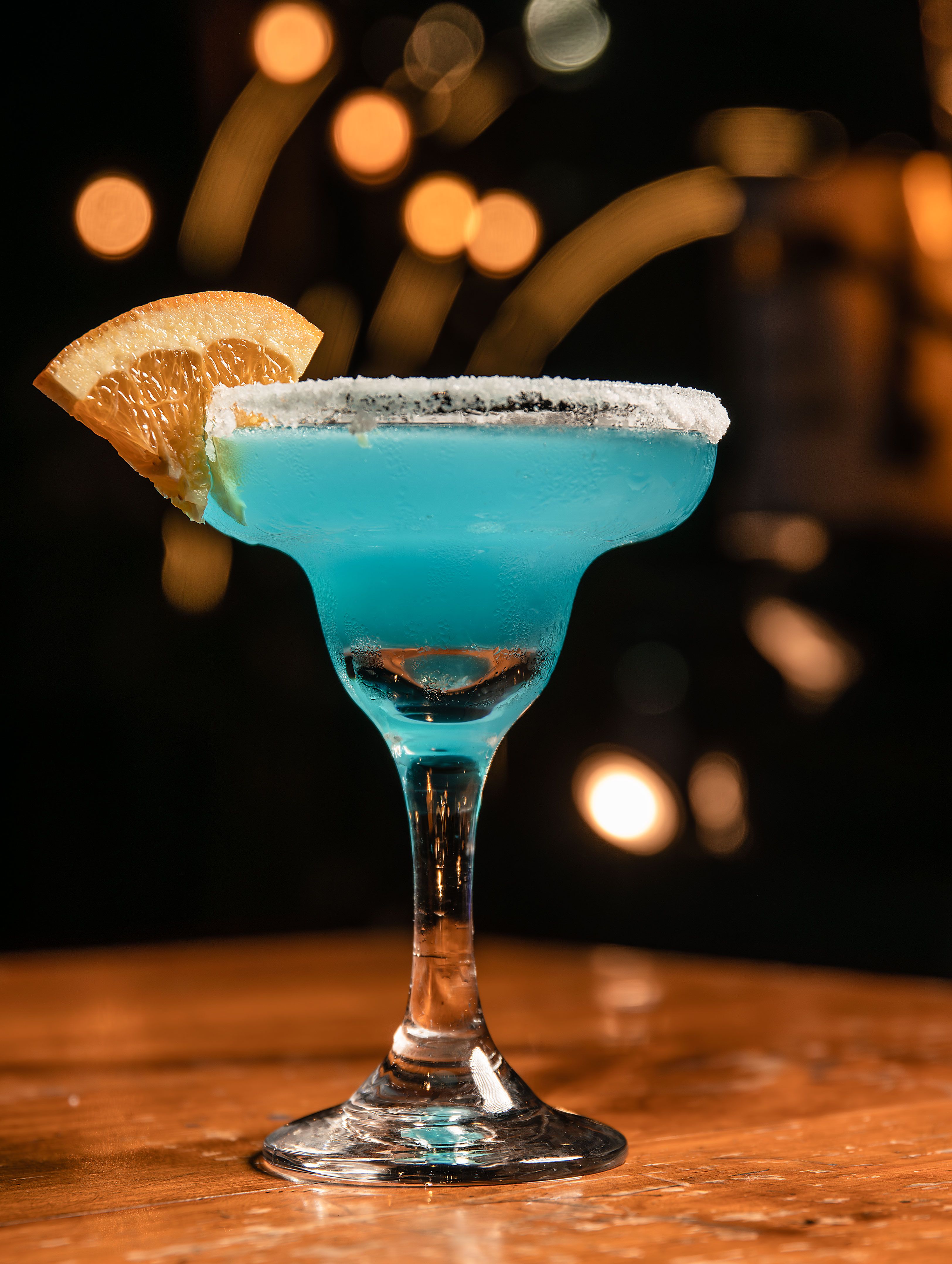 Refreshing Blue Cocktail with Orange Garnish · Free Stock Photo