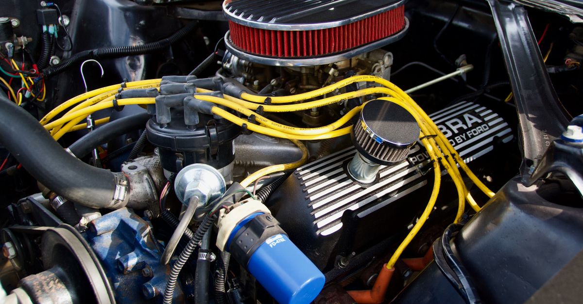 Detailed close-up of a Ford engine showcasing components and vibrant wiring.