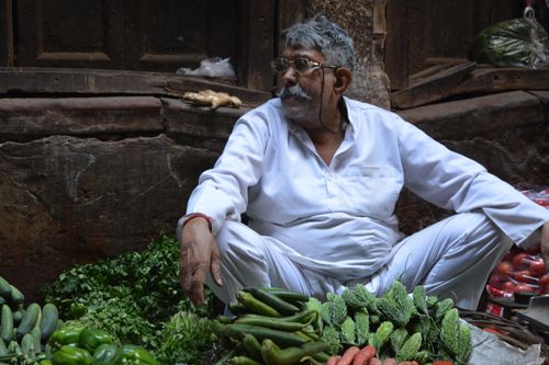 Free South Asian man selling fresh vegetables in Old Delhi, India. Stock Photo