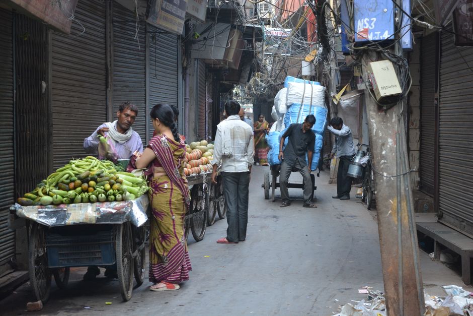 A vibrant street food stall in Delhi, India, serving traditional Indian snacks