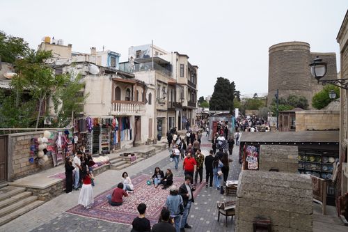 Free Vibrant street scene by Maiden Tower, showcasing local culture and bustling market ambiance in Baku, Azerbaijan. Stock Photo