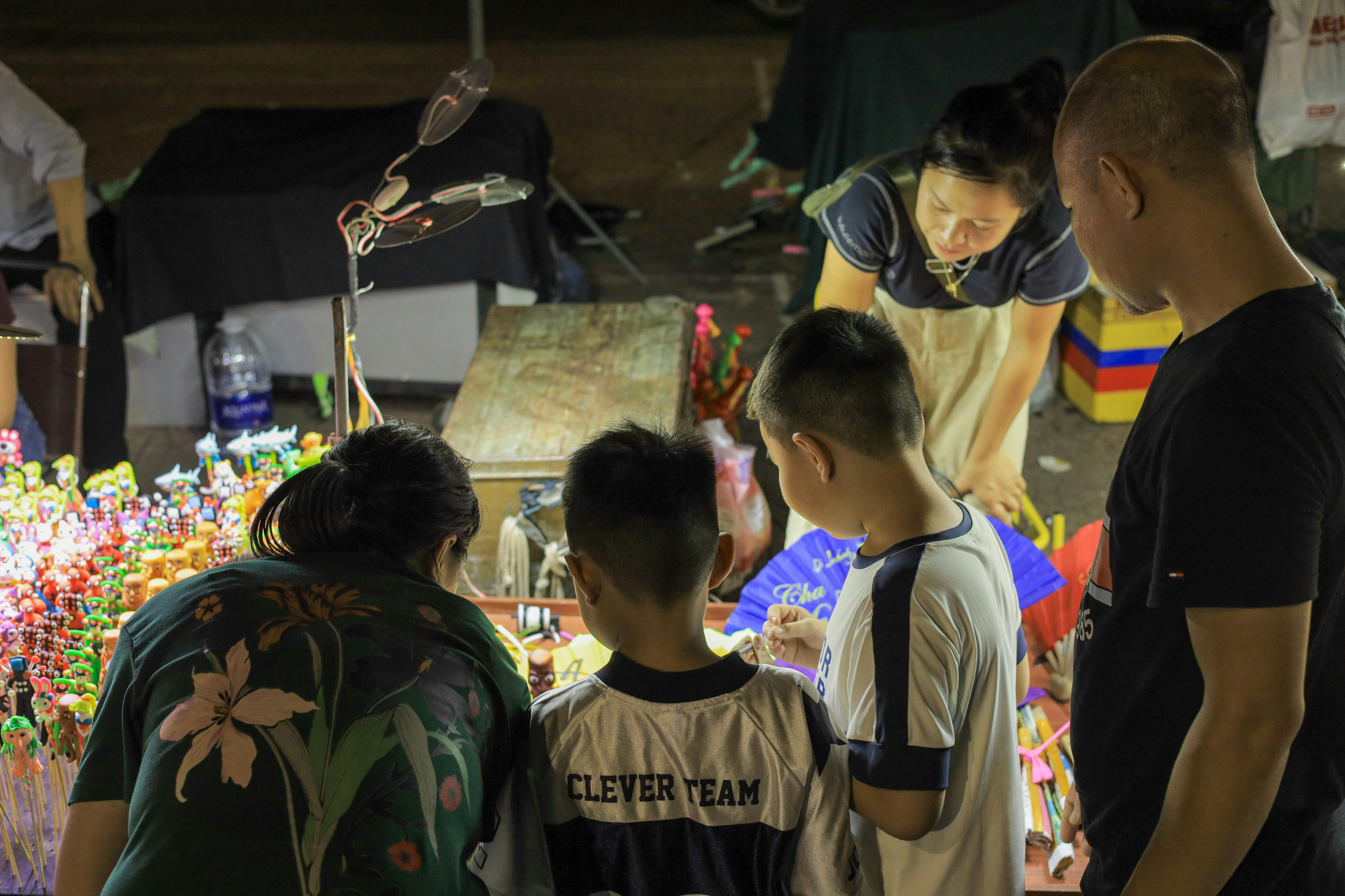 toddler family traveling southeast asia market