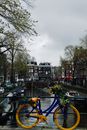 Colorful Bicycle on Amsterdam Canal Bridge
