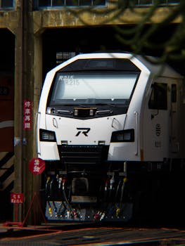 Front view of a modern train at Changhua Rail Depot in Taiwan, showcasing industrial design.