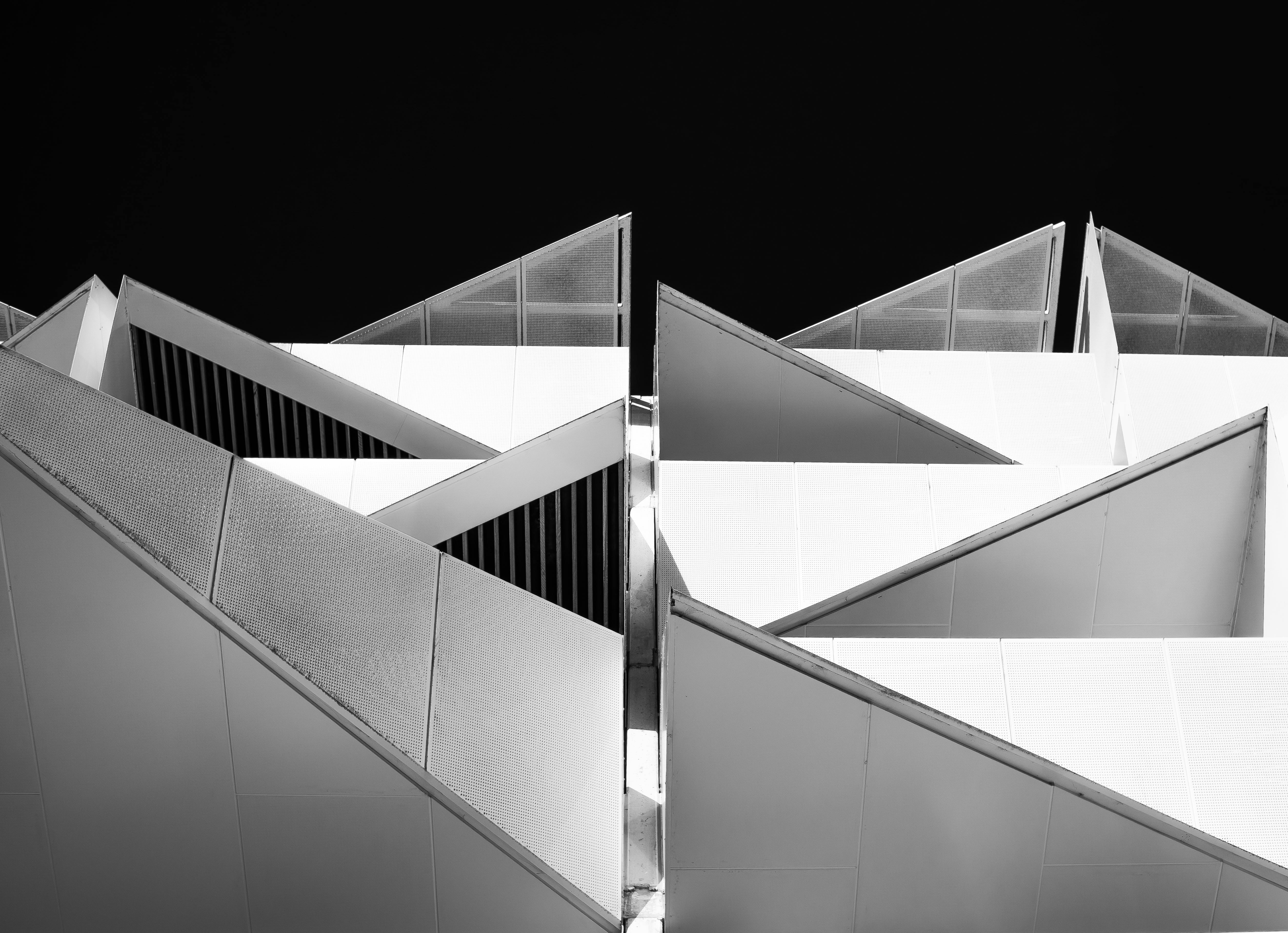 Striking geometric patterns of a modern building facade in black and white.
