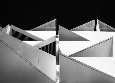 Striking geometric patterns of a modern building facade in black and white.