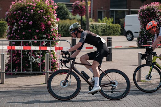 Cyclists participating in a competitive city street race, showcasing speed and endurance.