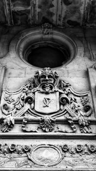 Detailed black-and-white photo of 16th century architectural stonework with intricate carvings.