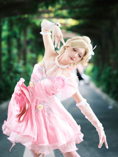 Free A graceful dancer in a pink dress performs outdoors, showcasing elegance and style. Stock Photo