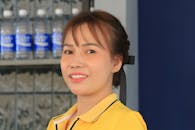 Portrait of Smiling Woman in Yellow Shirt