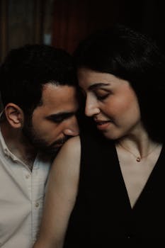 Intimate portrait of a couple sharing a tender moment indoors in Baku, Azerbaijan.