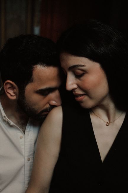 Intimate portrait of a couple sharing a tender moment indoors in Baku, Azerbaijan.