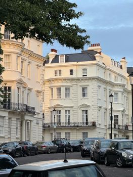 Charming Victorian townhouses under a clear sky, showcasing classic architecture.