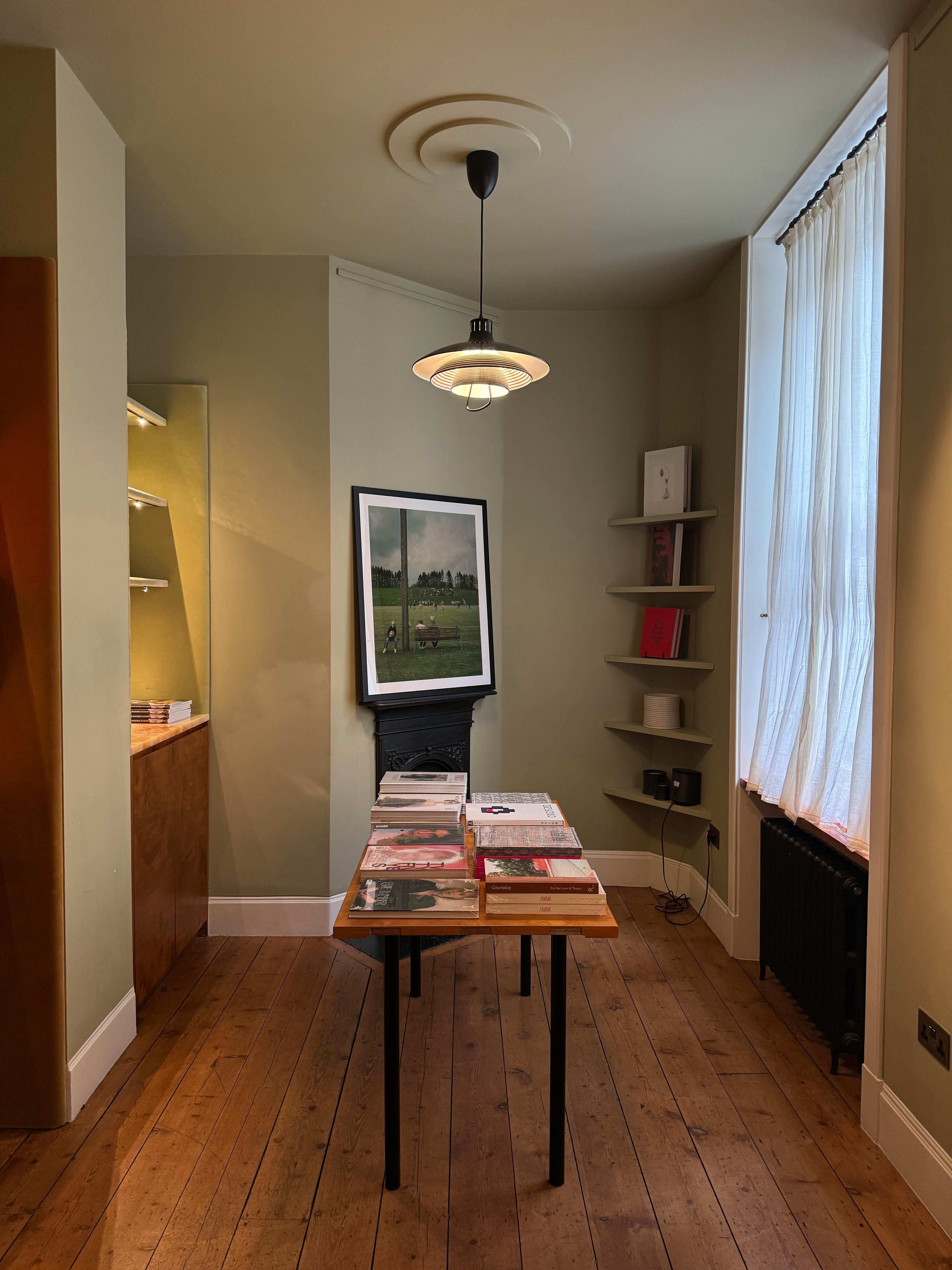 A warm, inviting corner of a bookstore with natural light and a selection of books.
