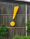 Bold Exclamation Mark on Wooden Wall