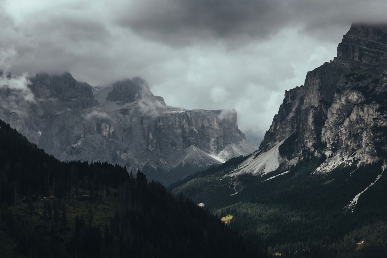 moody landscape of the dolomites with dramatic clouds in trentino alto