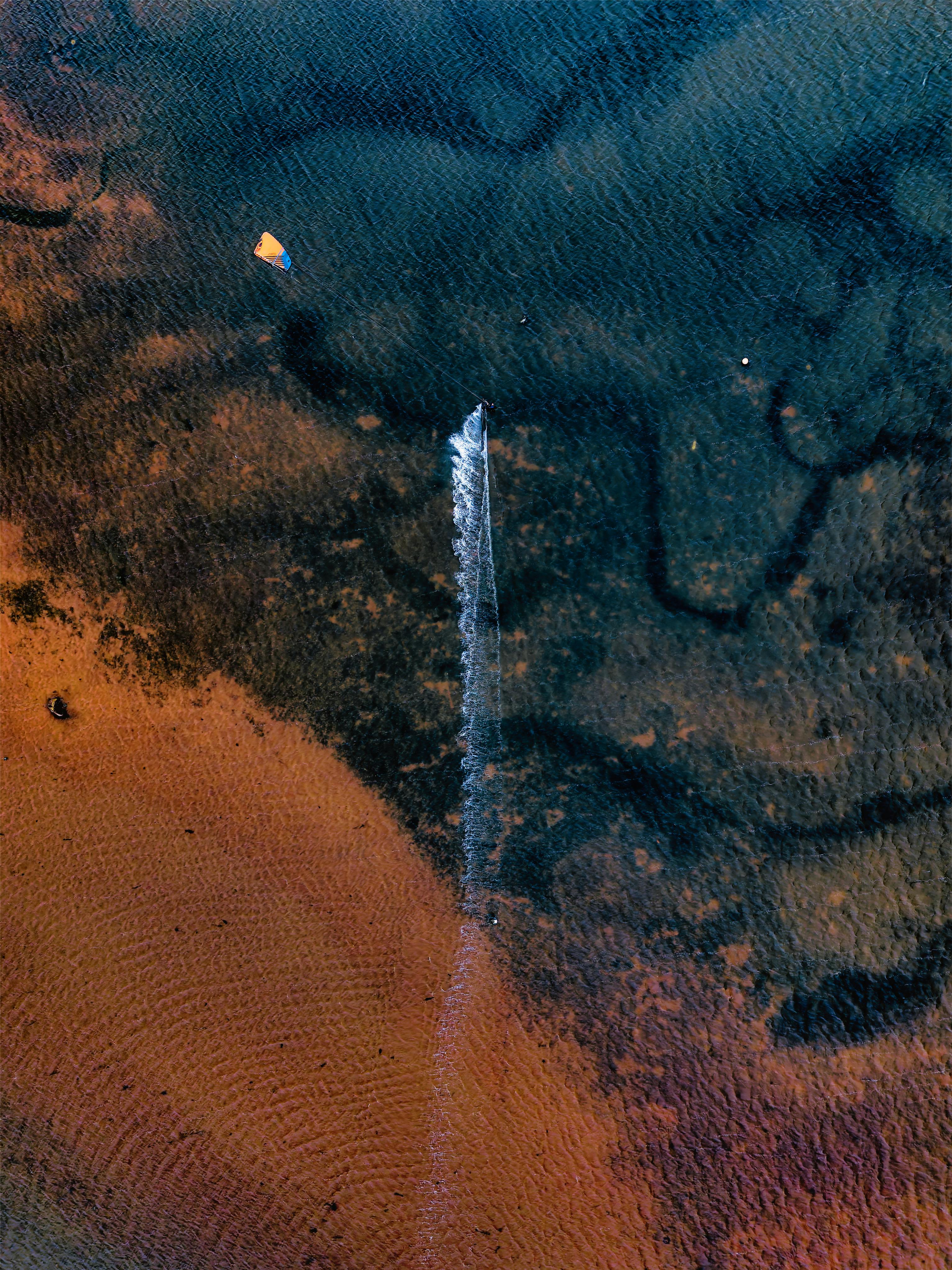 Drone shot showing Exmouth estuary's stunning coastline and vibrant waters.