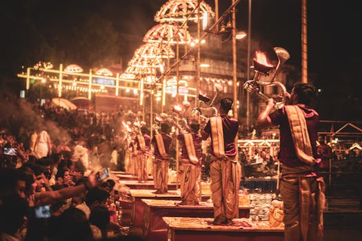 A captivating night scene of the Ganga Aarti ceremony on the riverbank in Varanasi, India.