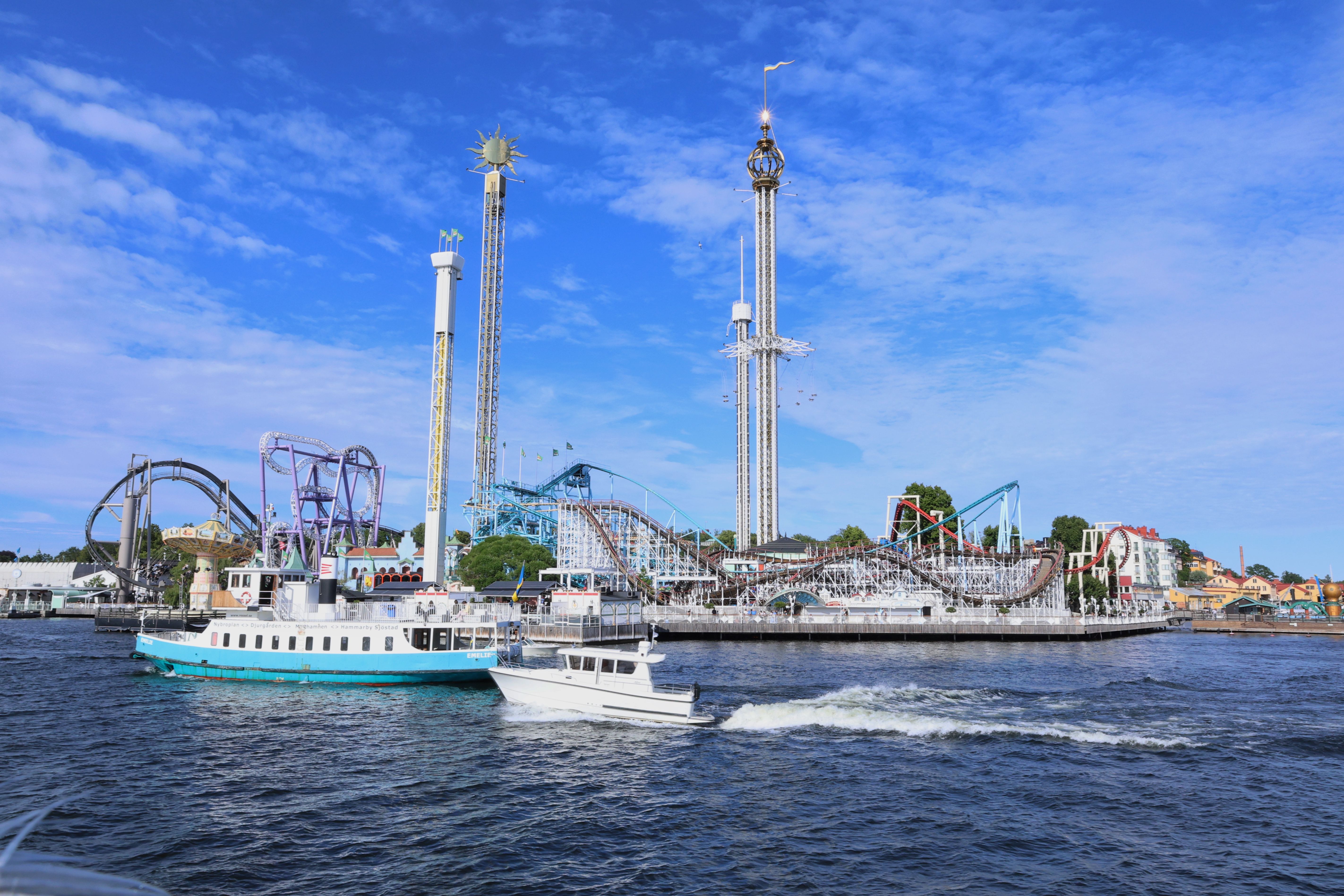 Explore the scenic view of Gröna Lund Amusement Park by the waterfront in Stockholm, Sweden.