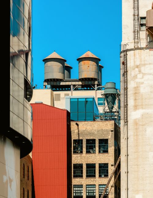 Free View of historic water towers atop brick buildings in downtown Minneapolis, Minnesota. Stock Photo