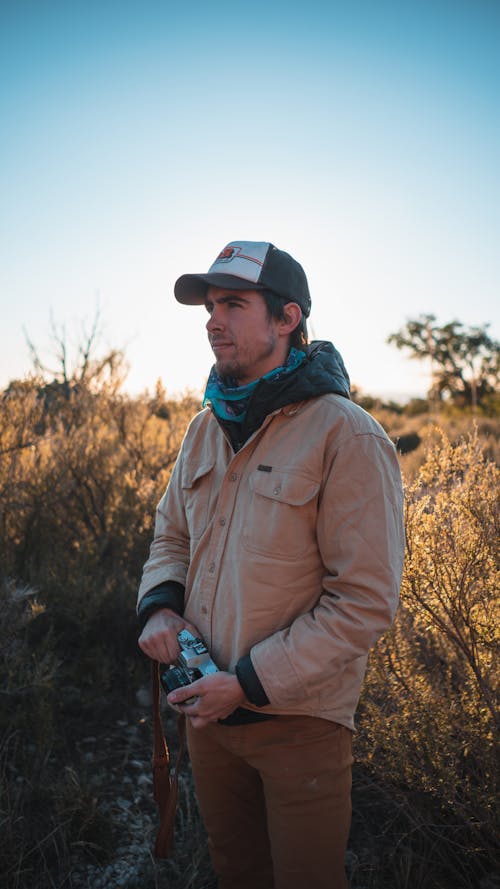 Man Wearing Brown Jacket