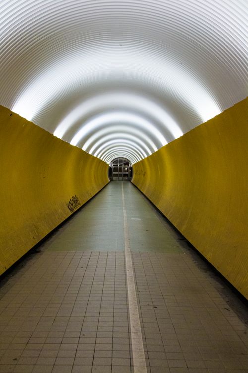 Free Bright yellow tunnel with arched ceiling in Stockholm, Sweden. Stock Photo