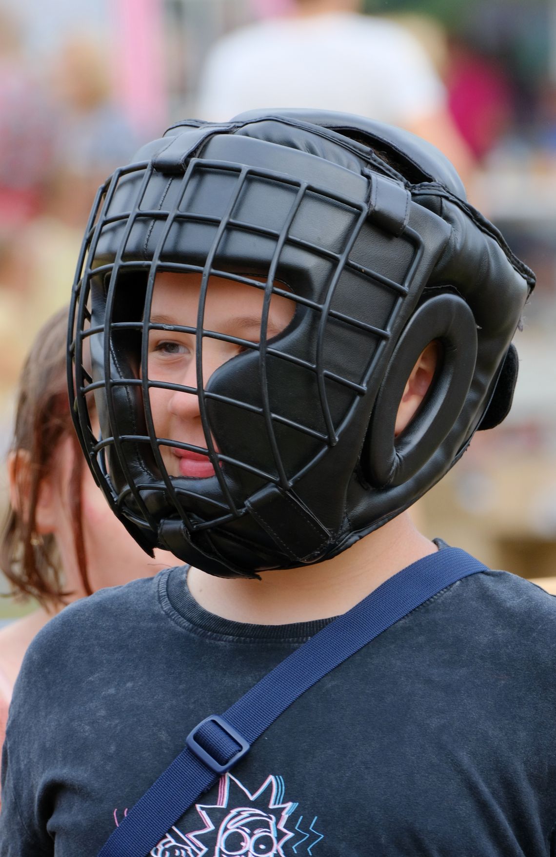 Child wearing protective headgear during outdoor play
