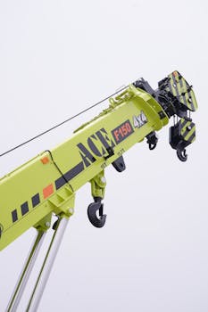 Detailed view of ACE F150 crane's boom arm against a white background, highlighting mechanical details.
