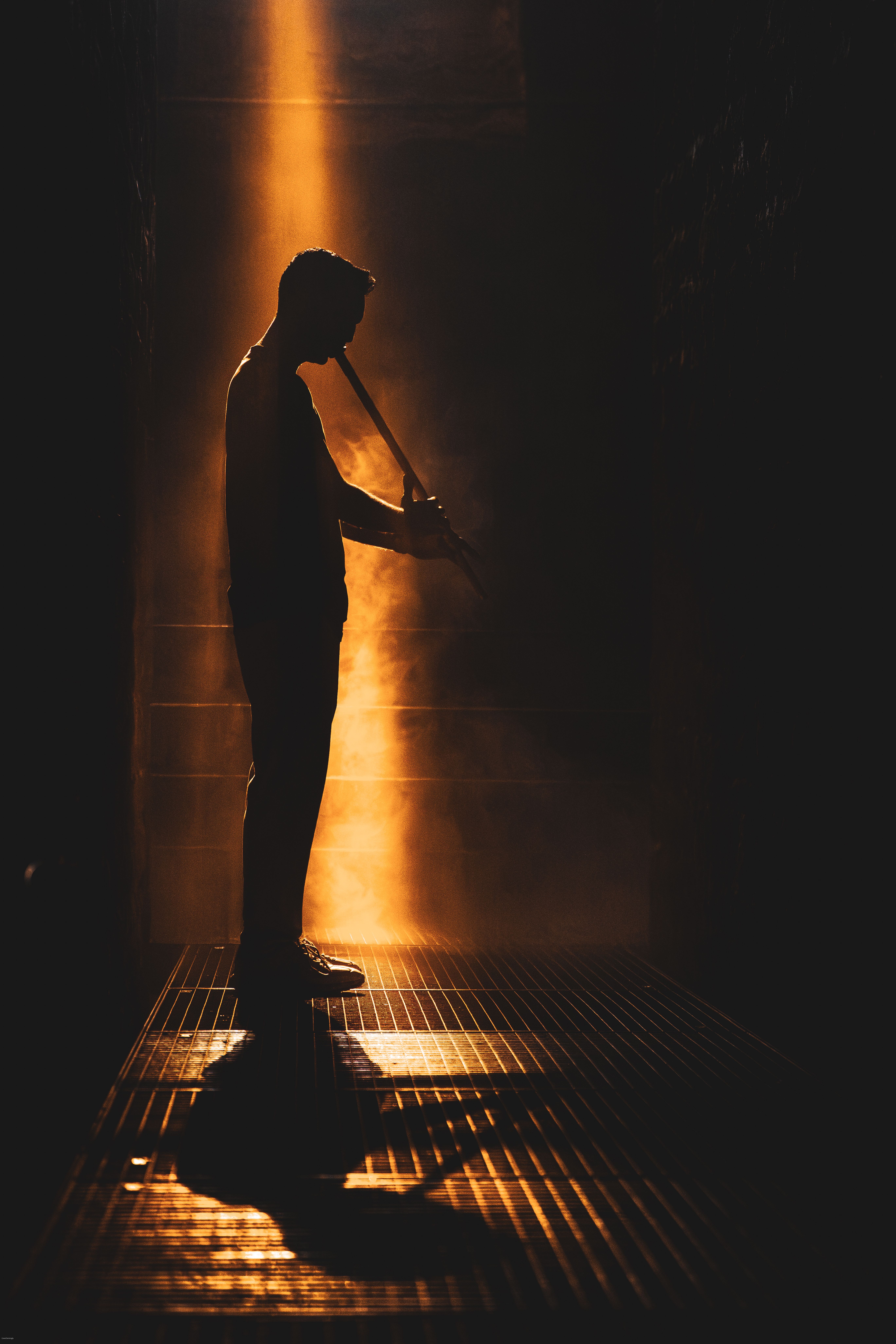 Silhouette of Musician Playing Flute in Dramatic Lighting · Free Stock ...