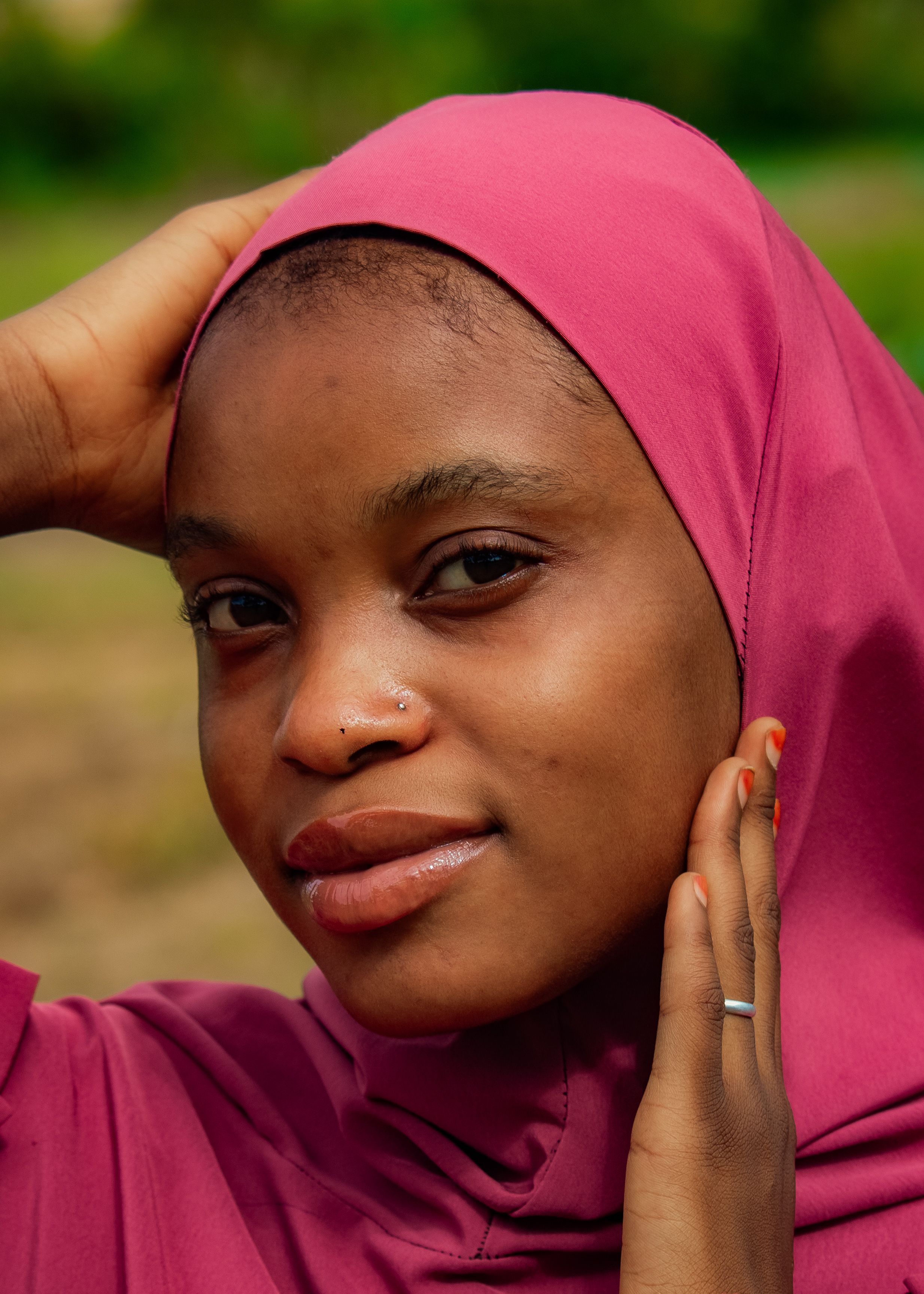 Portrait of a Woman in a Pink Headscarf Outdoors · Free Stock Photo