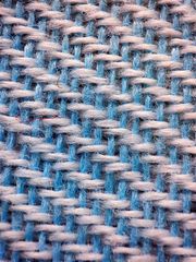 Macro of a blue and pink weave, photo by Arman Taheri on Pexels