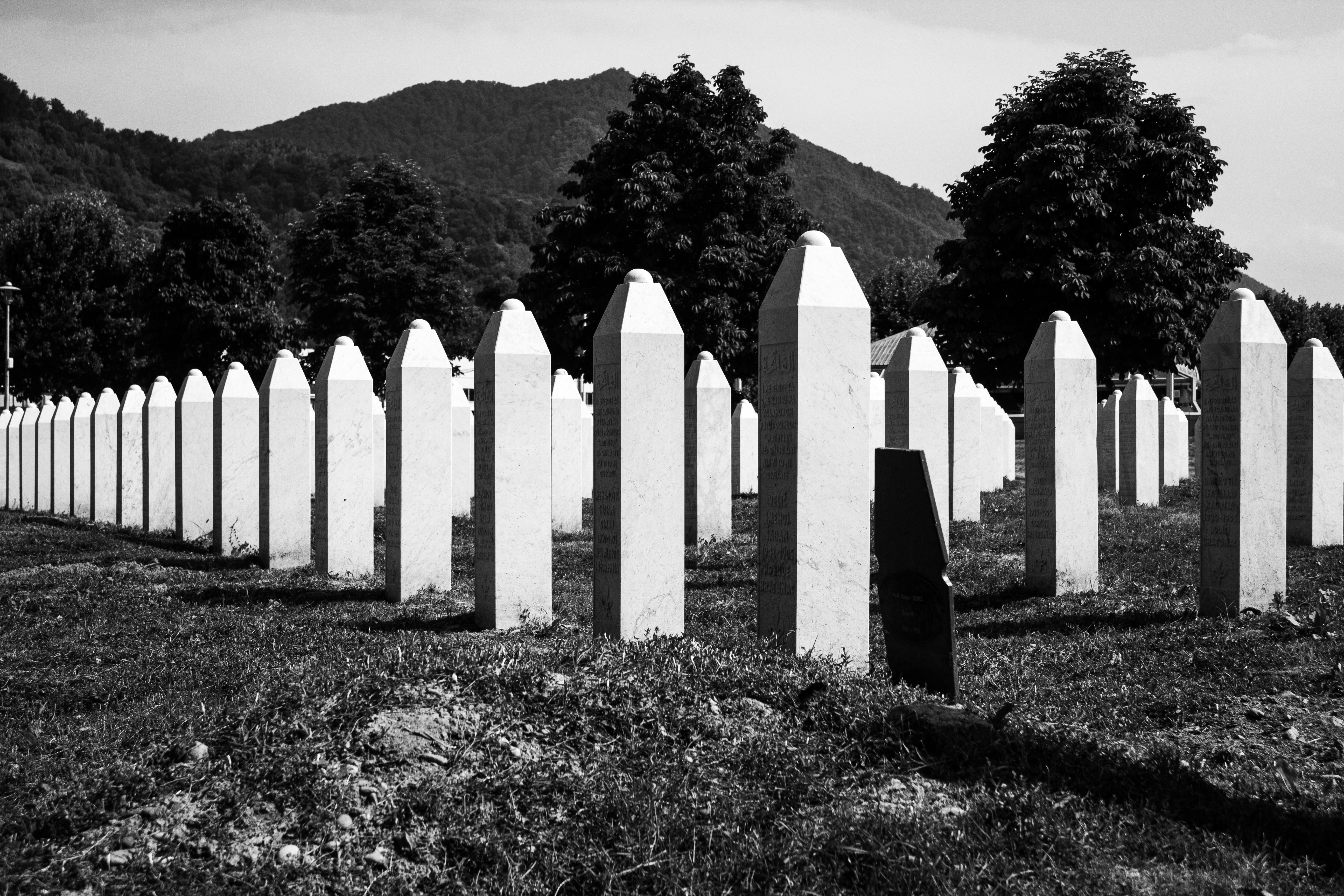 Black and white image of the Srebrenica cemetery, commemorating tragic history.