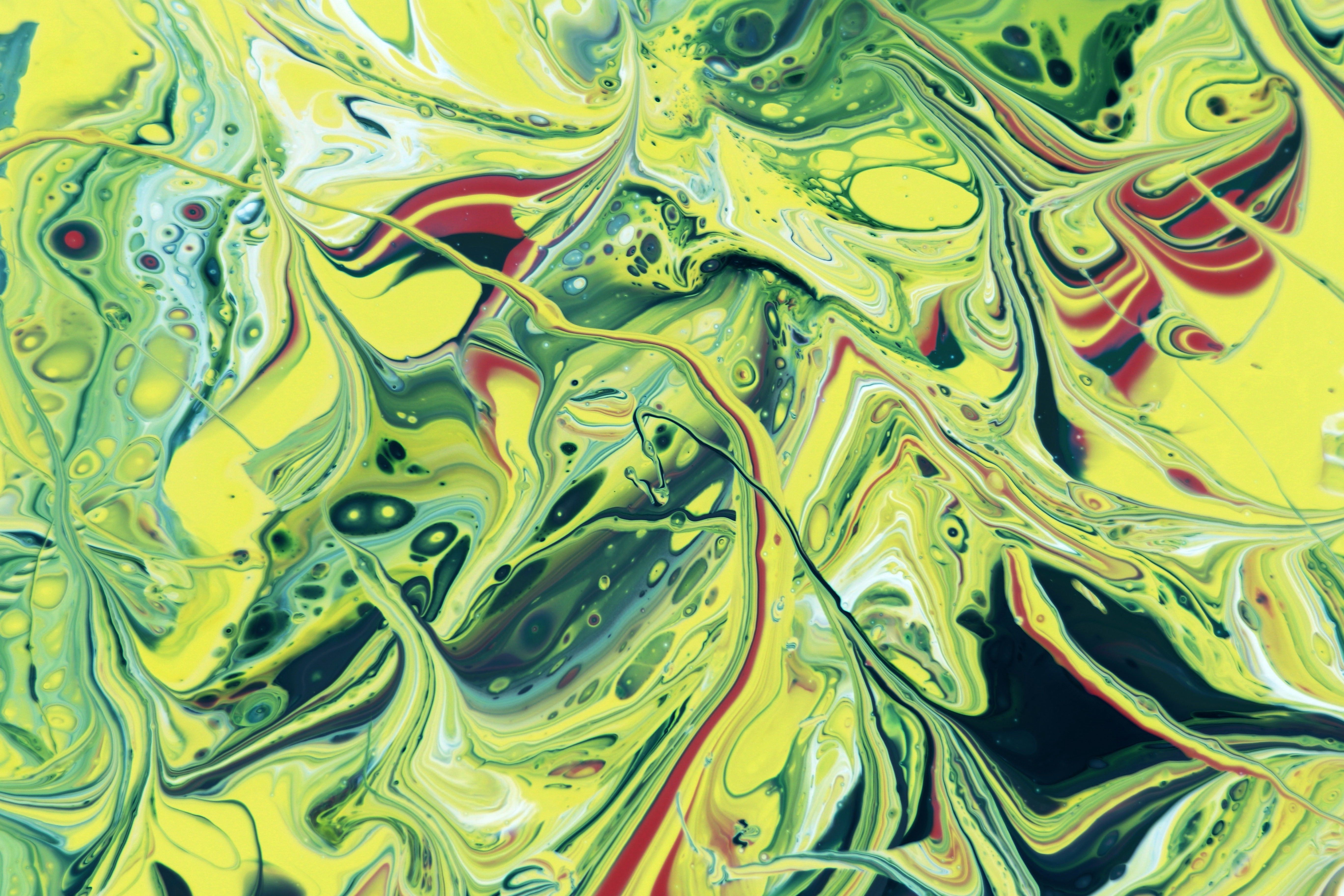 Vibrant Abstract Paint Swirl Art in Yellow and Green · Free Stock Photo