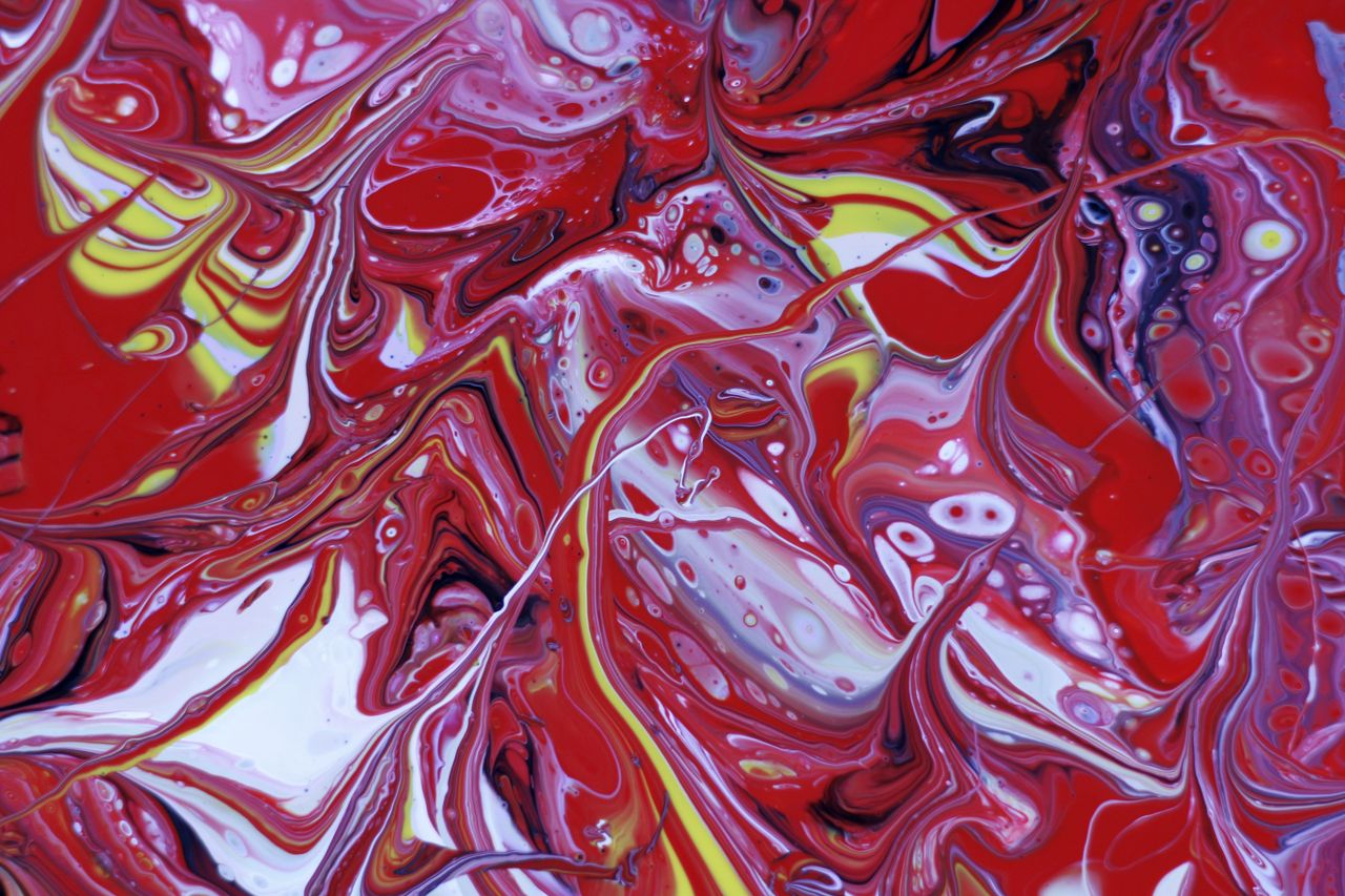 colorful abstract painting features dynamic red and yellow swirls crea