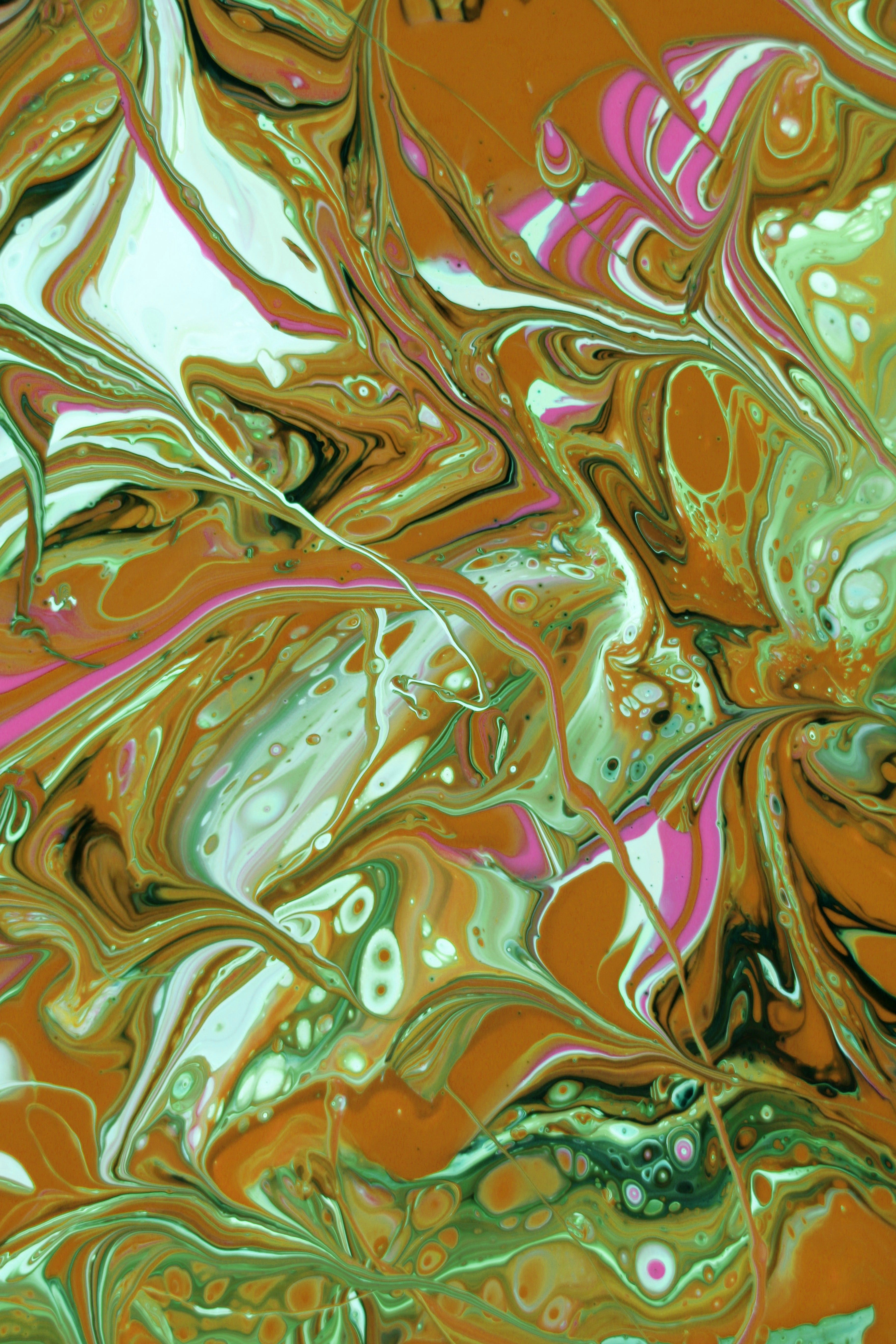 Abstract Fluid Art with Green and Orange Swirls · Free Stock Photo