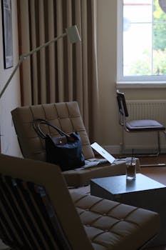 Modern living room with comfortable seating and natural light. Perfect for relaxation.
