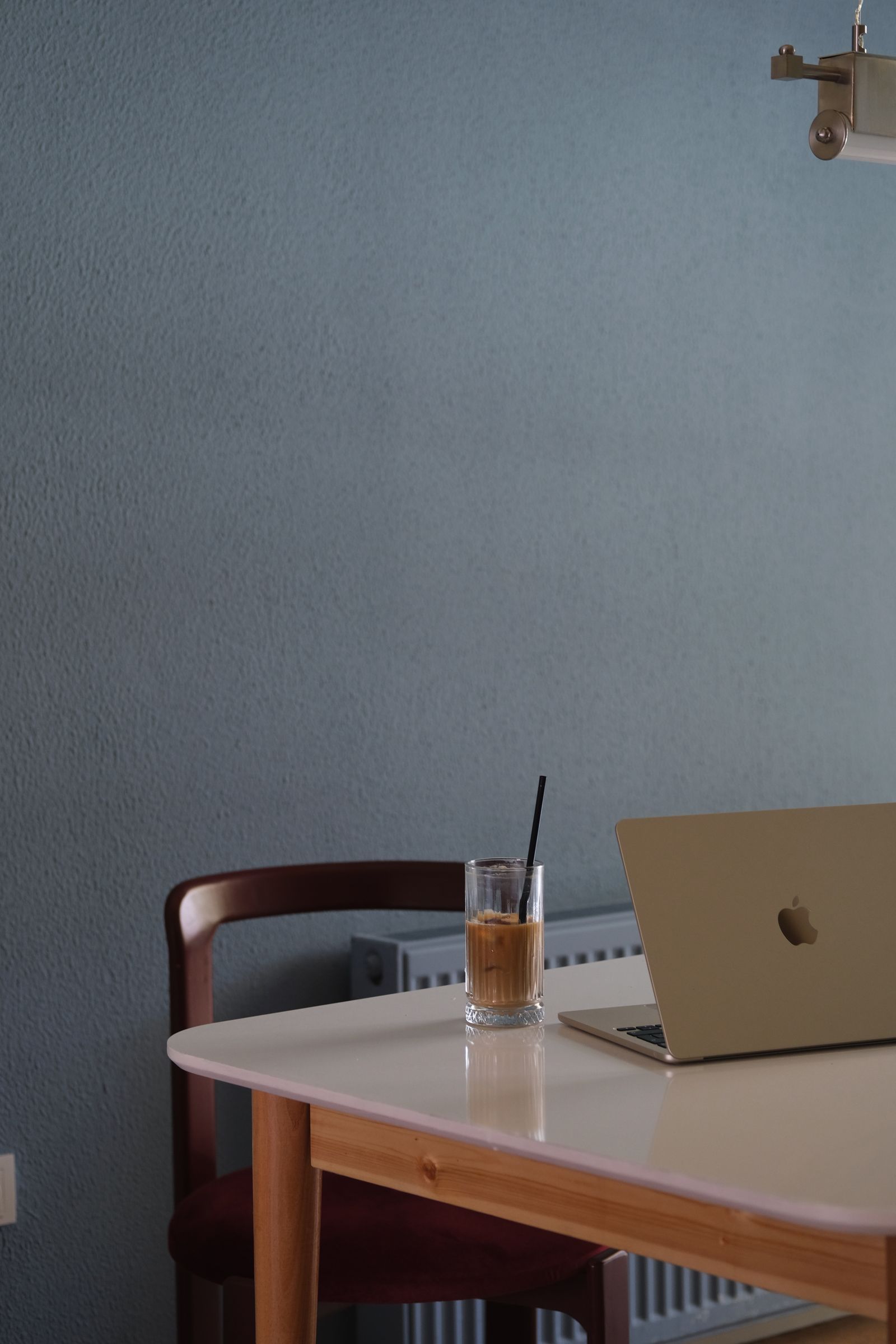 Minimalist workspace with a laptop and coffee.