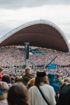 A captivating crowd at the Estonia Song Festival under the iconic Tallinna Lauluväljak.