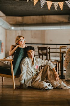 Two trendy individuals in a chic Lille cafe setting. Perfect bohemian lifestyle capture.