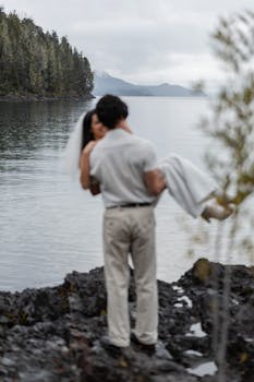 A couple shares a romantic moment by the lake in San Carlos de Bariloche, Argentina.