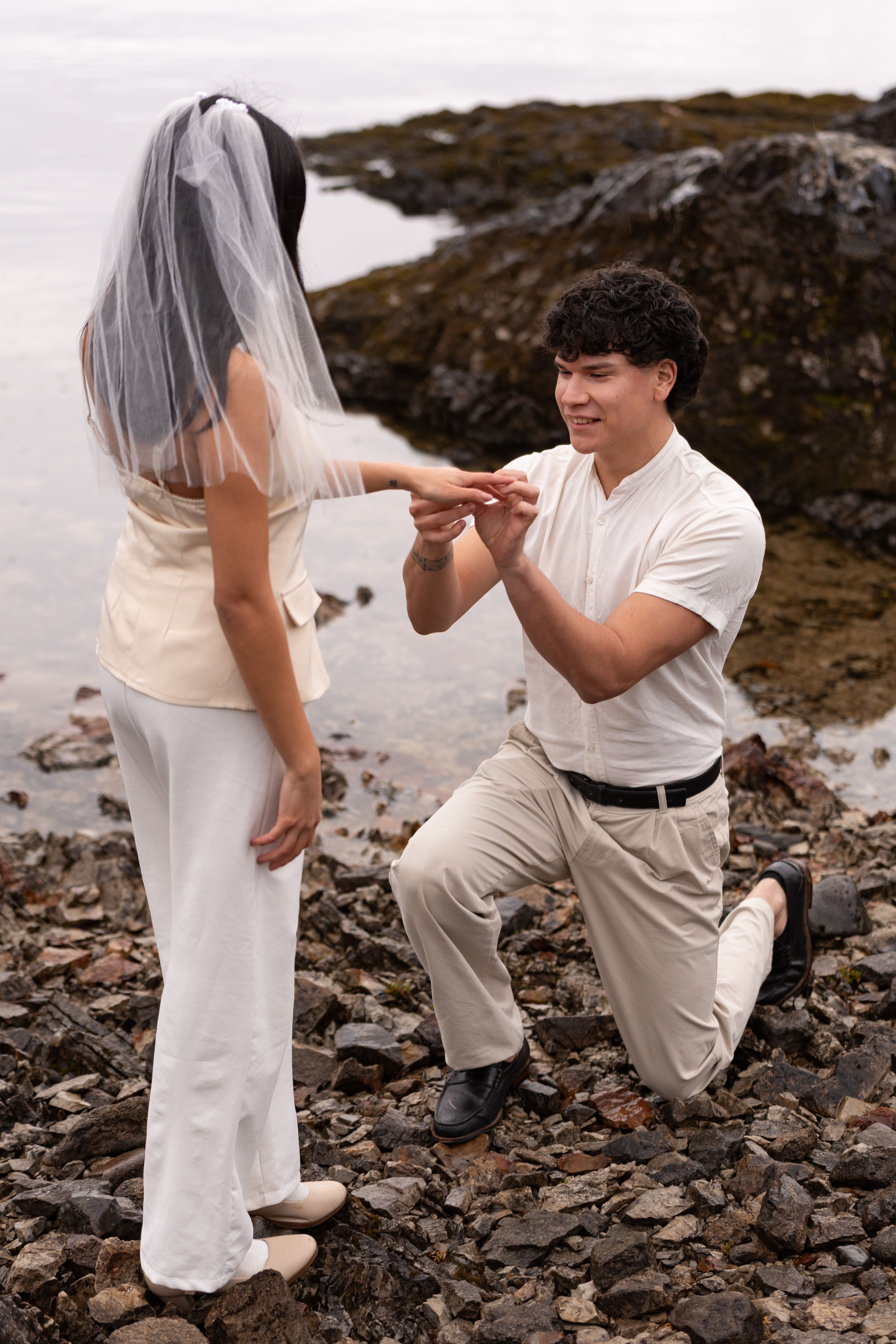 A romantic wedding proposal at the rocky shores of Bariloche, Argentina.