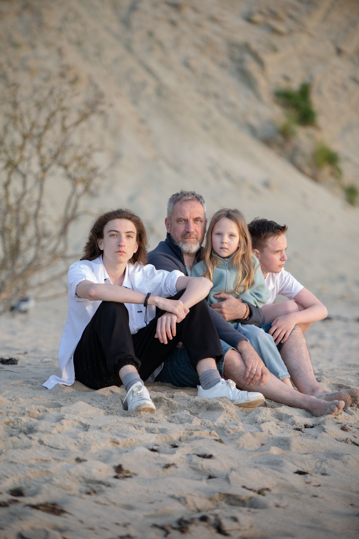 Family enjoying a warm sunset on the coast