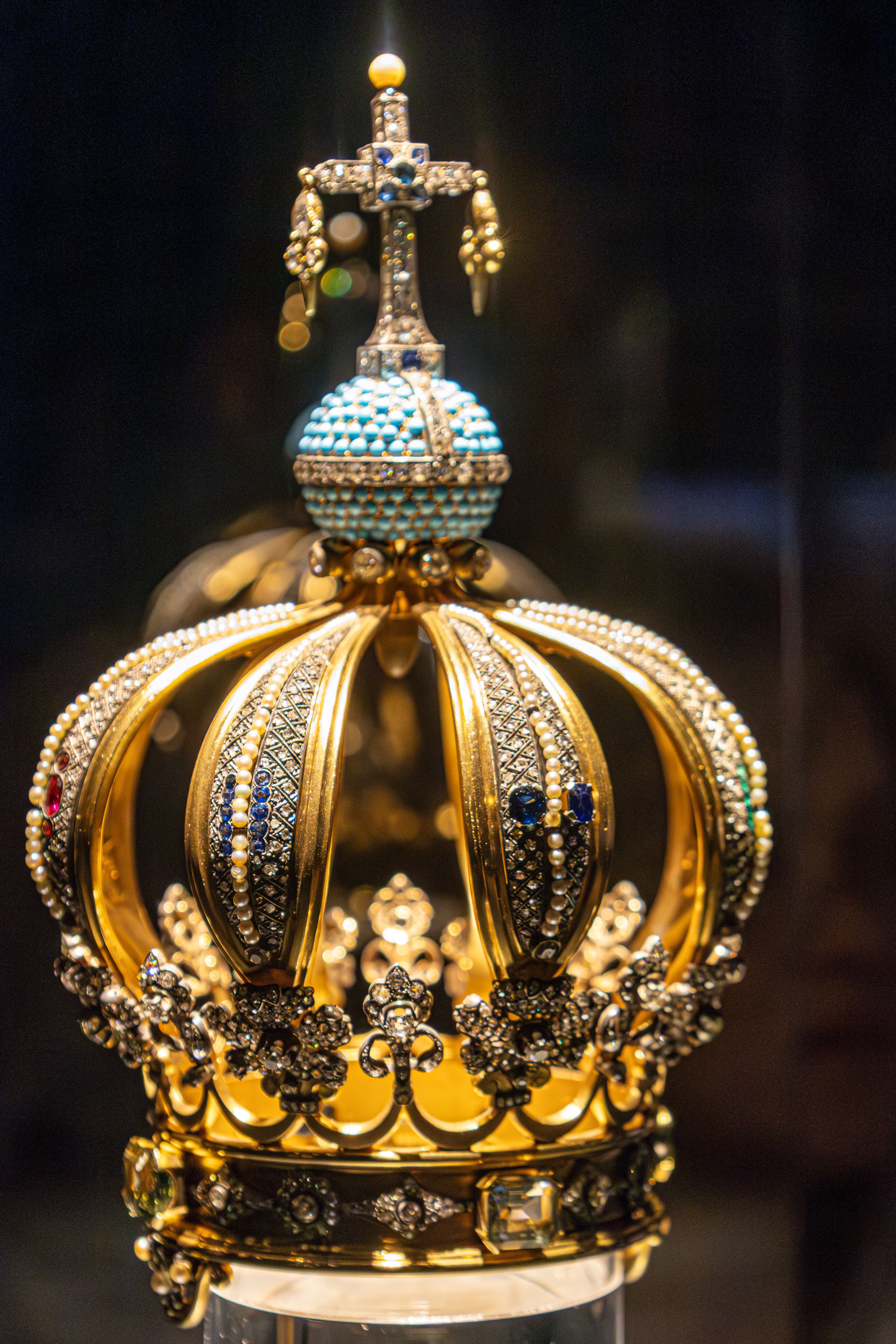 Ornate Golden Crown with Cross and Gemstones Displayed · Free Stock Photo