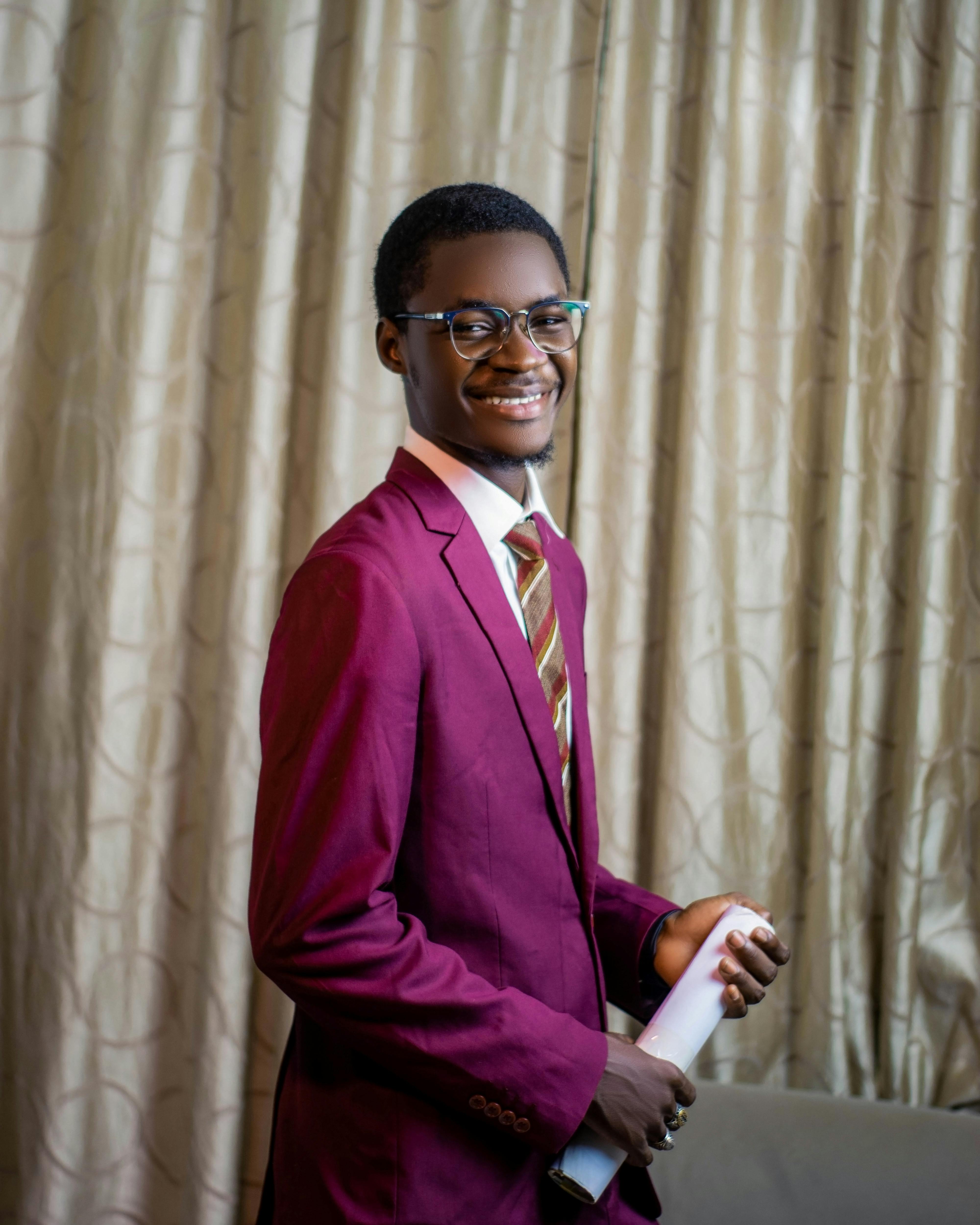 Smiling man in a suit, ready for a presentation or business meeting.