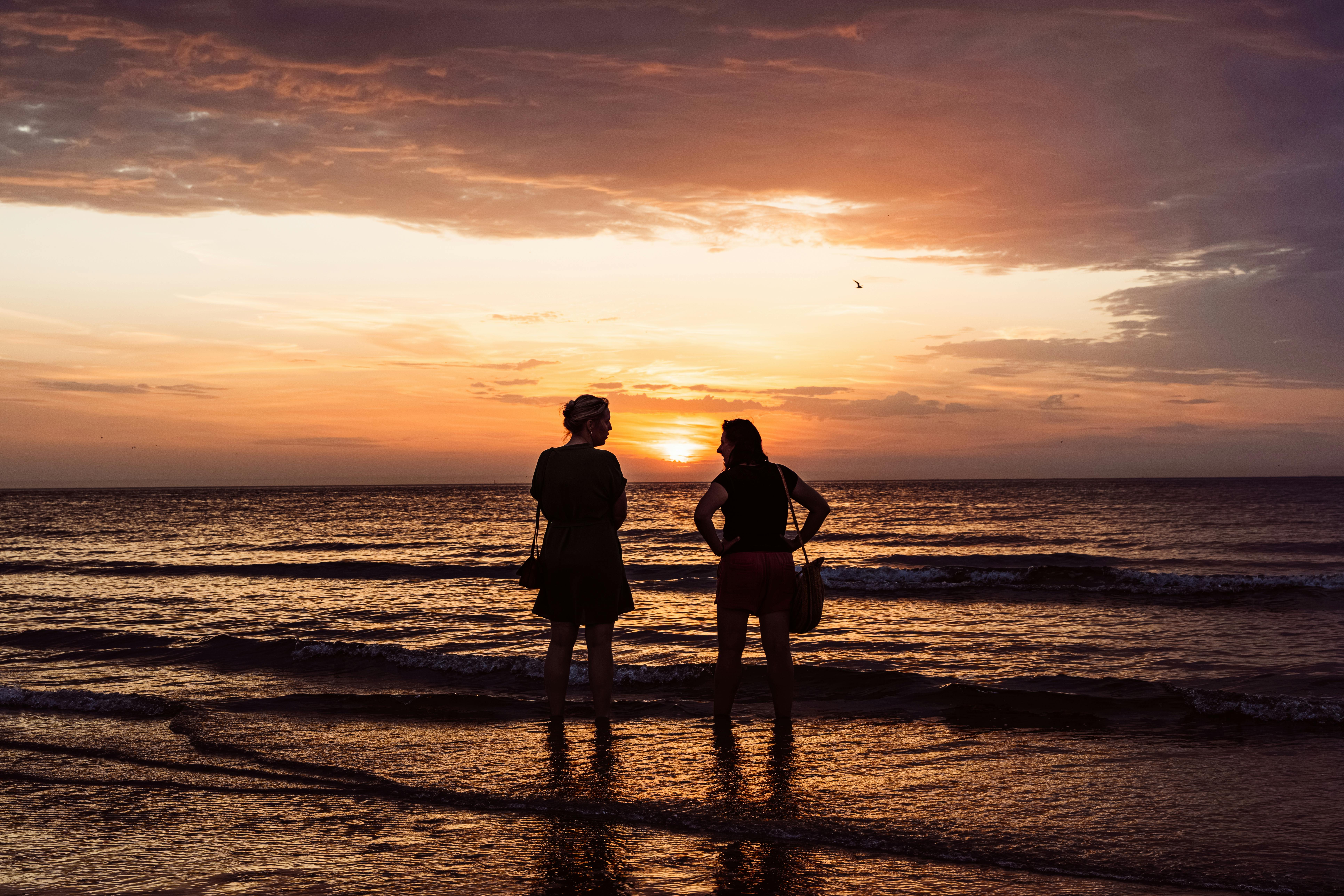 Two People Enjoying Sunset at Middelkerke Beach · Free Stock Photo, image size:7728x5152