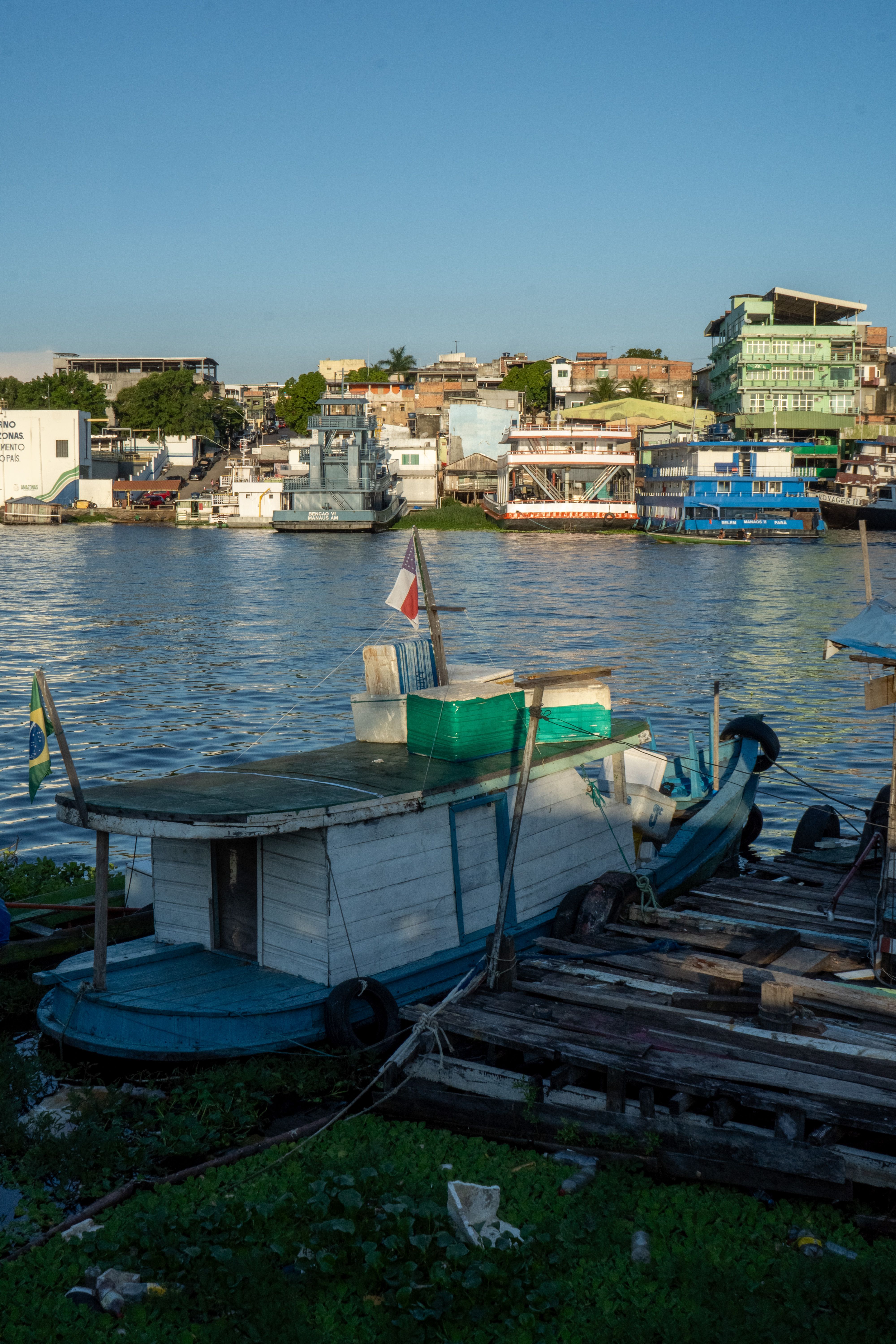 Colorful Boats Docked in Vibrant City Harbor · Free Stock Photo