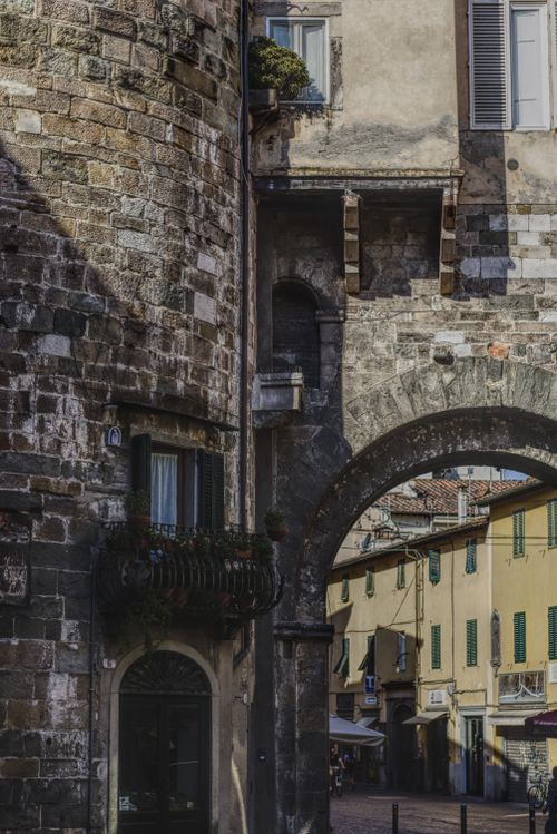 Free Explore the narrow streets and historic architecture of Lucca, Tuscany. Stock Photo