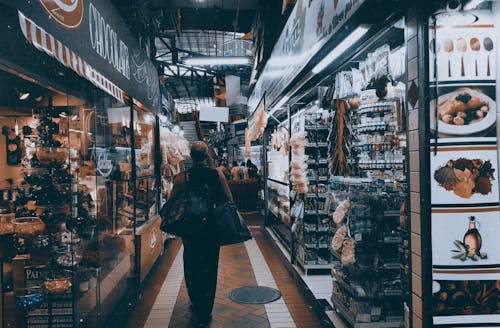 Free Person Standing on Pathway Near Store Stock Photo
