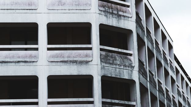 Close-up of a modern urban building showcasing its unique architectural design.